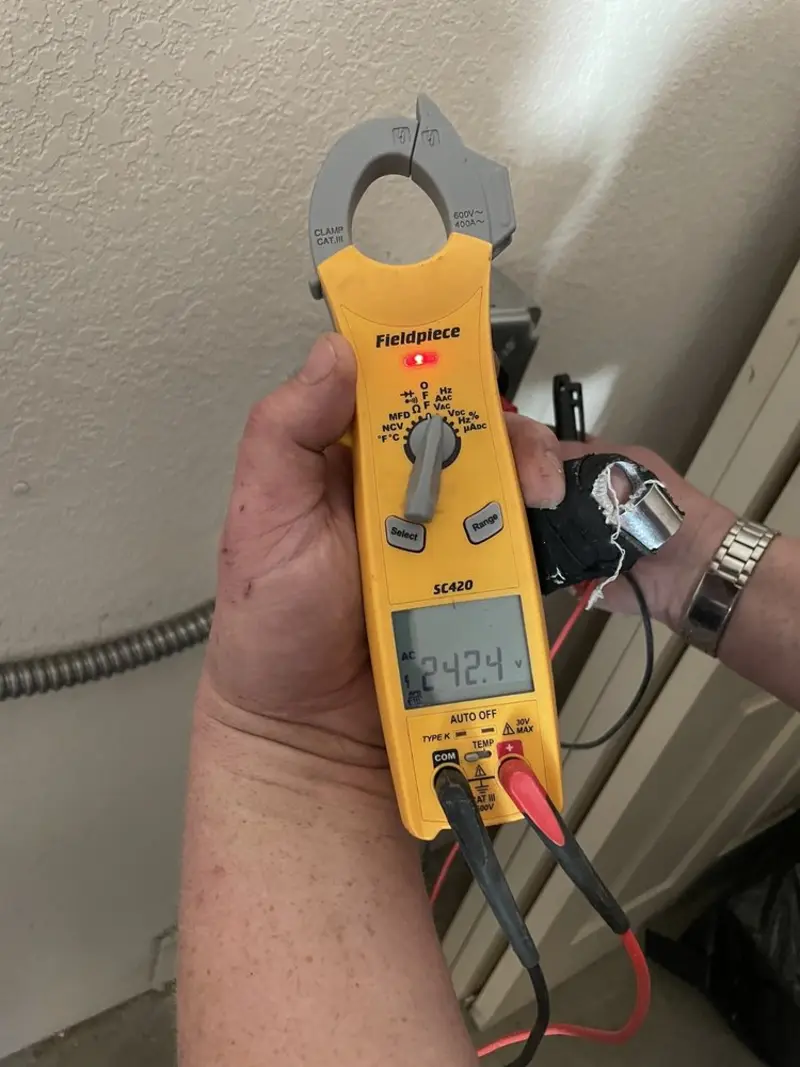 Voltage testing with clamp meter during Outlet Installation in La Crosse